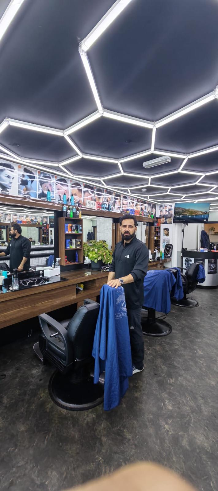 Barber chair and barber inside Top Ten Barbers